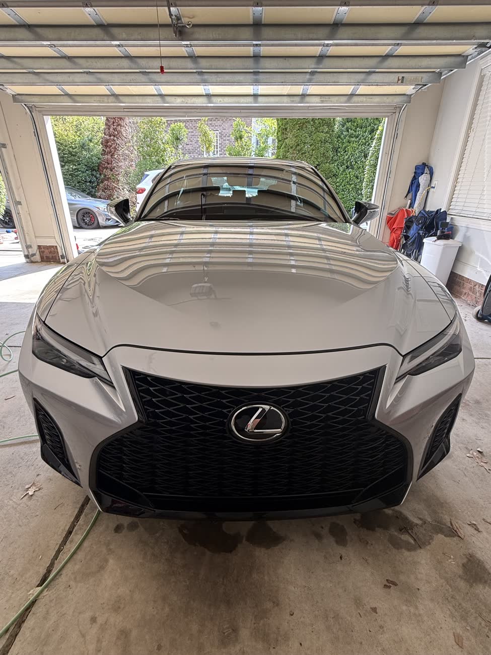 Silver Lexus IS front end after a full detail