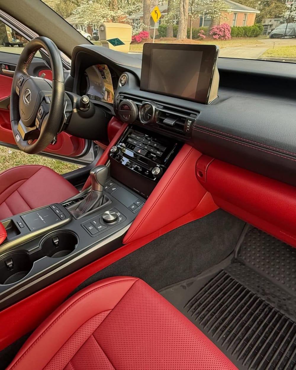 Lexus IS-F red leather interior after detail — clean console and dashboard